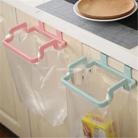 Hanging trash bag holder on kitchen cabinet