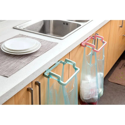 Hanging trash bag holder on kitchen cabinet