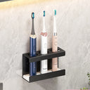 Wall-mounted toothbrush holder for electric toothbrushes