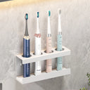 Wall-mounted toothbrush holder for electric toothbrushes