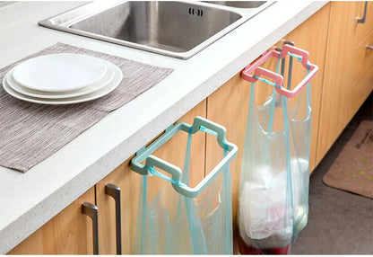 Hanging trash bag holder on kitchen cabinet